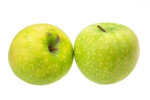 grüner Apfel auf Weiß foto