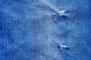 Denim Blue Jeans zerrissene Modedesign Textur Nahaufnahme Hintergrund Draufsicht foto