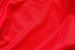 roter sportbekleidungsstoff fußballtrikot trikot textur hintergrund foto