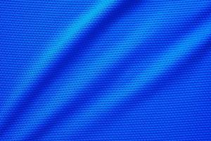 blauer Fußballtrikot Kleidung Stoff Textur Sportbekleidung Hintergrund, Nahaufnahme Draufsicht foto