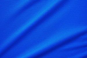 blauer Fußballtrikot Kleidung Stoff Textur Sportbekleidung Hintergrund, Nahaufnahme Draufsicht foto