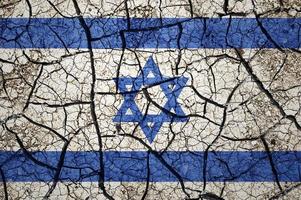 trockenes Bodenmuster auf der Flagge Israels. land mit dürrekonzept. Wasserproblem. Land der trockenen, rissigen Erde. foto