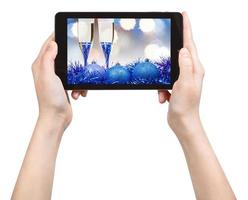 Machen Sie ein Bild von Blue Xmas Still Life mit Tablet foto