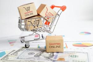 online-shopping, einkaufswagenbox mit geld, import export, finanzhandel. foto