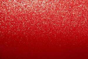 glänzender roter hintergrund mit unscharfem bokeh. festlicher glitzerverlauf. weihnachten, neujahr, geburtstag, 8. märz, valentinstag und internationaler frauentag foto