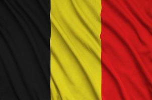 Die belgische Flagge ist auf einem Sportstoff mit vielen Falten abgebildet. Sportteam-Banner foto