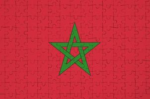 Die marokkanische Flagge ist auf einem Faltpuzzle abgebildet foto