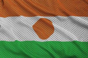 Niger-Flagge gedruckt auf einem Polyester-Nylon-Sportswear-Mesh-Gewebe m foto