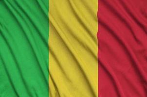 Die Mali-Flagge ist auf einem Sportstoff mit vielen Falten abgebildet. Sportteam-Banner foto