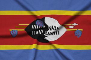 Swasiland-Flagge ist auf einem Sportstoff mit vielen Falten abgebildet. Sportteam-Banner foto
