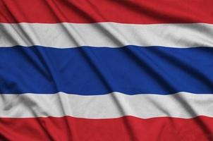 Die thailändische Flagge ist auf einem Sportstoff mit vielen Falten abgebildet. Sportteam-Banner foto