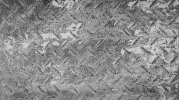 rostiger edelstahlhintergrund nahtloses muster der rosteisenwand oder -tapete im schwarz-weiß-ton oder monochrom. strukturiertes oder Grunge-Paneel und hartes Materialkonzept. foto