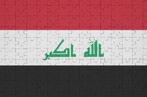 die irak-flagge ist auf einem faltpuzzle abgebildet foto