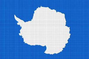 Die am weitesten verbreitete Flagge der Antarktis ist die Karte des Kontinents. Flagge der Antarktis auf der Textur. Collage. foto