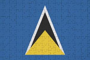 die flagge von st. lucia ist auf einem faltpuzzle abgebildet foto