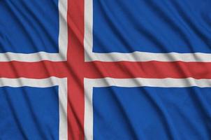 die isländische flagge ist auf einem sportstoff mit vielen falten abgebildet. Sportteam-Banner foto
