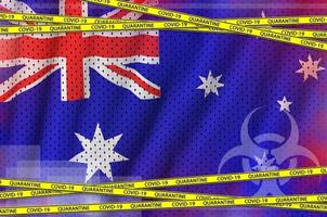 australien-flagge und covid-19-quarantäne-gelbband. Coronavirus- oder 2019-ncov-Viruskonzept foto