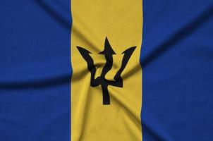 barbados flagge ist auf einem sportstoff mit vielen falten abgebildet. Sportteam-Banner foto