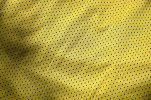 Sportbekleidung Stoff Textur Hintergrund, Draufsicht auf gelbe Textiloberfläche foto