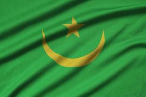 die mauretanische flagge ist auf einem sportstoff mit vielen falten abgebildet. Sportteam-Banner foto