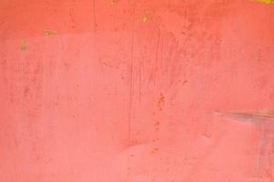 rotes Eisen alte zerkratzte zerlumpte Wand aus Blech. Textur, Hintergrund foto