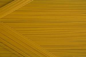 Spaghetti Nudeln italienische Küche Essen. gelber langer spaghetti-lebensmittelhintergrund foto