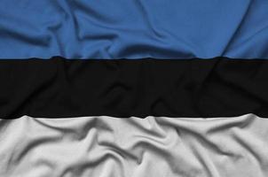 Die estnische Flagge ist auf einem Sportstoff mit vielen Falten abgebildet. Sportteam-Banner foto