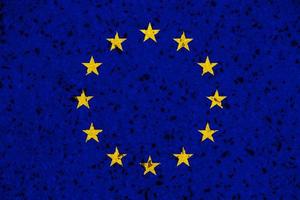 Flagge der Europäischen Union auf einem strukturierten Hintergrund. Konzept-Collage. foto