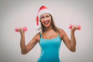Weihnachts-Fitness-Frau foto
