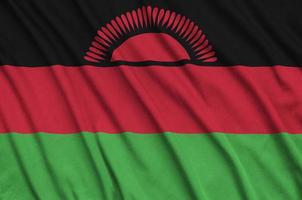 Die Malawi-Flagge ist auf einem Sportstoff mit vielen Falten abgebildet. Sportteam-Banner foto