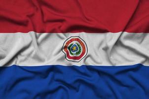 die paraguay-flagge ist auf einem sportstoff mit vielen falten abgebildet. Sportteam-Banner foto