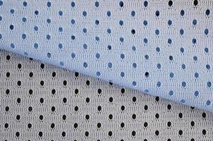 blaues Mesh-Sportbekleidungsstoff-Textil-Hintergrundmuster foto