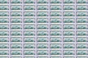 50 US-Dollar-Scheine, die im Geldproduktionsförderer gedruckt wurden. Collage aus vielen Rechnungen. Konzept der Währungsabwertung foto