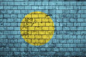 Palau-Flagge wird auf eine alte Backsteinmauer gemalt foto