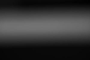 dunkelschwarzer und grauer, unscharfer Hintergrund mit Farbverlauf hat ein wenig abstraktes Licht. weicher hintergrund für tapeten, design, grafik und präsentation, hintergrundwand foto