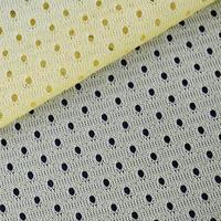 Gelbes Mesh-Sportbekleidungsstoff-Textil-Hintergrundmuster foto