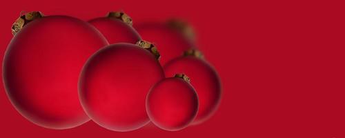 Weihnachtsbanner. rote Kugeln auf rotem Grund. weihnachten, feiertag, grüße. hintergrund für werbung und geschäft. foto