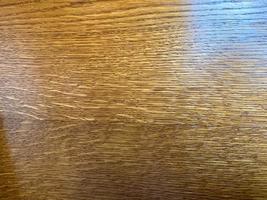 textur aus glatter brauner holzlackierter textur. der Hintergrund foto