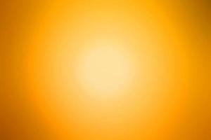 abstrakter Hintergrund des orangefarbenen Unschärfeeffekts foto