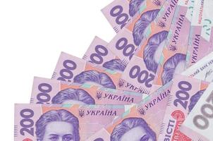 200 ukrainische Griwna-Scheine liegen in unterschiedlicher Reihenfolge isoliert auf Weiß. Konzept für lokales Bankwesen oder Geldverdienen foto