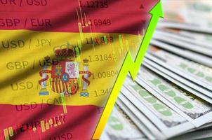 spanien flagge und diagramm wächst die us-dollarposition mit einem fan von dollarscheinen foto