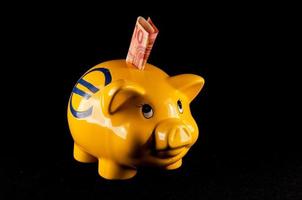 Sparschwein mit Geld foto