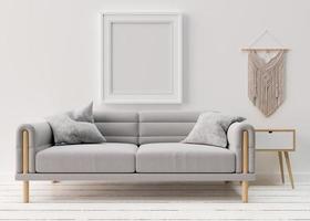 leerer bilderrahmen an weißer wand im modernen wohnzimmer. Mock-up-Interieur im skandinavischen Boho-Stil. freier speicherplatz, kopieren sie platz für ihr bild. graues Sofa. 3D-Rendering. foto