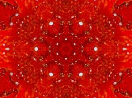 buntes rotes Feuer Kaleidoskop Hintergrund abstrakte Blume und symmetrisches Muster foto