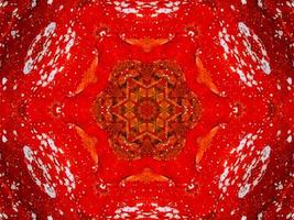 buntes rotes Feuer Kaleidoskop Hintergrund abstrakte Blume und symmetrisches Muster foto