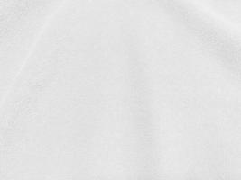 weißer sauberer Wollbeschaffenheitshintergrund. leichte natürliche Schafwolle. weiße nahtlose Baumwolle. Textur aus flauschigem Fell für Designer. Nahaufnahme Fragment weißer Wollteppich.. foto