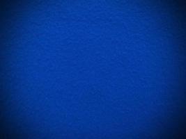 fühlte sich blau weich rau Textilmaterial Hintergrundtextur Nahaufnahme, Pokertisch, Tennisball, Tischdecke. leerer blauer Stoffhintergrund. foto