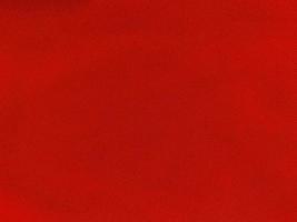 rote Baumwollstoffstruktur als Hintergrund verwendet. leerer roter Stoffhintergrund aus weichem und glattem Textilmaterial. es ist platz für text.. foto