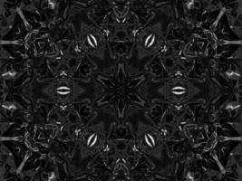 schwarzer silberner metallischer Kaleidoskophintergrund. abstraktes und symmetrisches Muster mit dunklen Vibes. foto