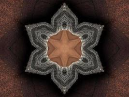 abstrakter Kaleidoskop-Hintergrund. schöne mehrfarbige Kaleidoskop-Textur. einzigartiges Kaleidoskop-Design. mit einer hellbraunen Grundfarbe und umgeben von Dunkelbraun foto